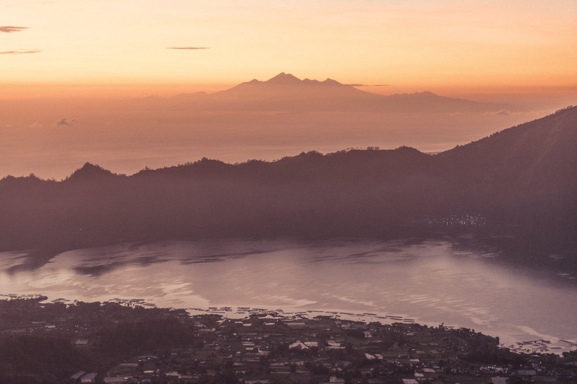 Sunset over mountains and a lake